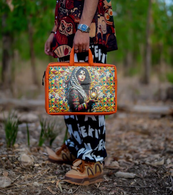 Moroccan leather laptop bag featuring a design inspired by a woman holding a vintage Moroccan lantern.